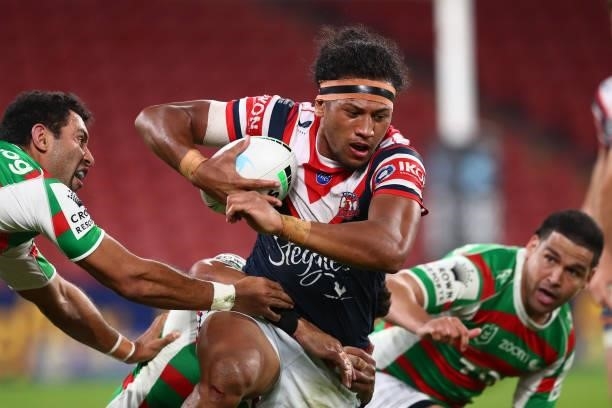 Sitili Tupouniua of the Roosters is tackled during the round 24 NRL match between the Sydney Roosters and the South Sydney Rabbitohs at Suncorp...
