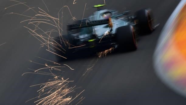Sparks fly behind Sebastian Vettel of Germany driving the Aston Martin AMR21 Mercedes during practice ahead of the F1 Grand Prix of Belgium at...