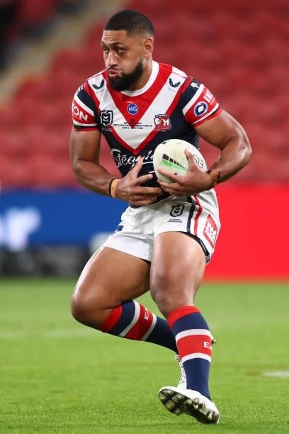 Isaac Liu of the Roosters runs the ball during the round 24 NRL match between the Sydney Roosters and the South Sydney Rabbitohs at Suncorp Stadium...