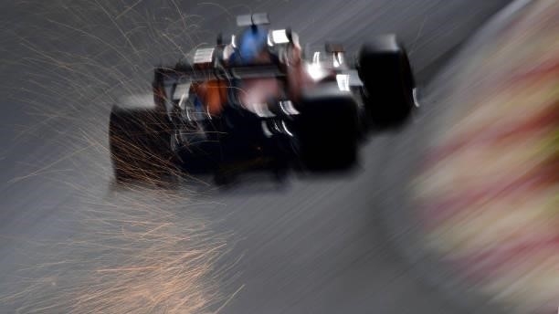 Sparks fly behind Daniel Ricciardo of Australia driving the McLaren F1 Team MCL35M Mercedes during practice ahead of the F1 Grand Prix of Belgium at...