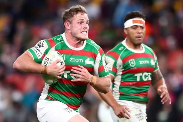 Thomas Burgess of the Rabbitohs runs the ball during the round 24 NRL match between the Sydney Roosters and the South Sydney Rabbitohs at Suncorp...