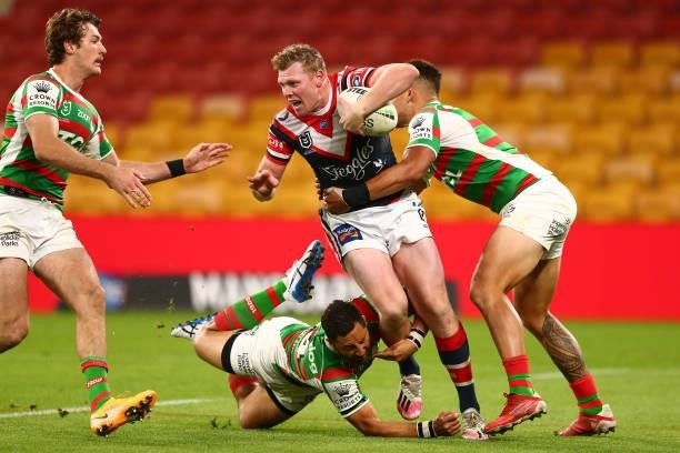 Drew Hutchison of the Roosters fends off Benji Marshall of the Rabbitohs during the round 24 NRL match between the Sydney Roosters and the South...