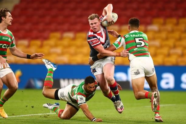 Drew Hutchison of the Roosters fends off Benji Marshall of the Rabbitohs during the round 24 NRL match between the Sydney Roosters and the South...