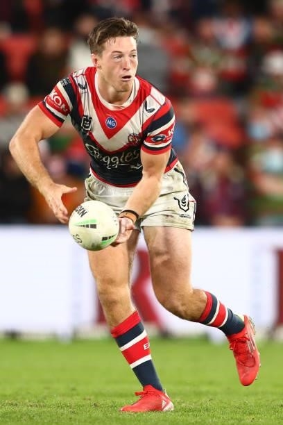 Sam Verrills of the Roosters offloads the ball during the round 24 NRL match between the Sydney Roosters and the South Sydney Rabbitohs at Suncorp...