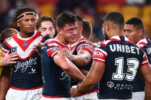 Joseph Manu of the Roosters is seen with a cheek injury after a tackle from Latrell Mitchell of the Rabbitohs during the round 24 NRL match between...