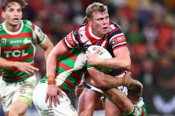 Drew Hutchison of the Roosters is tackled during the round 24 NRL match between the Sydney Roosters and the South Sydney Rabbitohs at Suncorp Stadium...