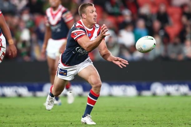 Ben Marschke of the Roosters offloads the ball during the round 24 NRL match between the Sydney Roosters and the South Sydney Rabbitohs at Suncorp...