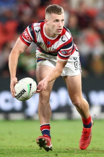 Sam Walker of the Roosters offloads the ball during the round 24 NRL match between the Sydney Roosters and the South Sydney Rabbitohs at Suncorp...
