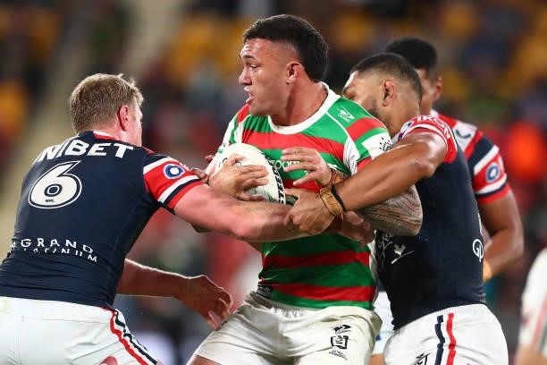 Jaydn Su'A of the Rabbitohs is tackled during the round 24 NRL match between the Sydney Roosters and the South Sydney Rabbitohs at Suncorp Stadium on...