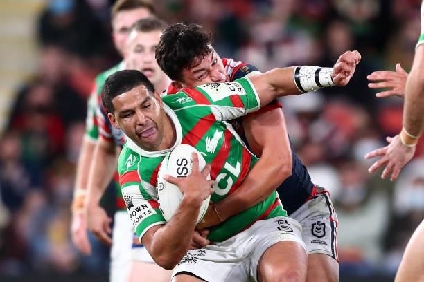 Cody Walker of the Rabbitohs is tackled during the round 24 NRL match between the Sydney Roosters and the South Sydney Rabbitohs at Suncorp Stadium...