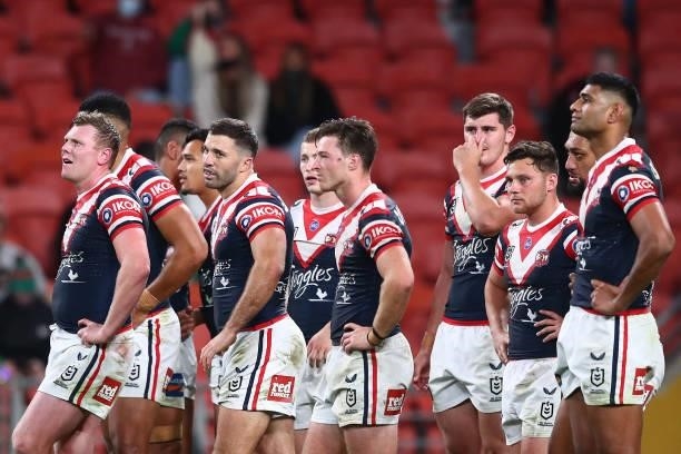 James Tedesco of the Roosters looks on with team mates after a Rabbitohs try during the round 24 NRL match between the Sydney Roosters and the South...