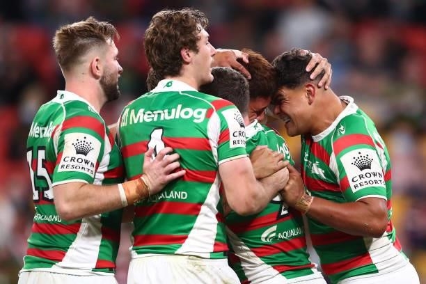 Latrell Mitchell of the Rabbitohs celebrates with try-scorer Jaxson Paulo of the Rabbitohs during the round 24 NRL match between the Sydney Roosters...