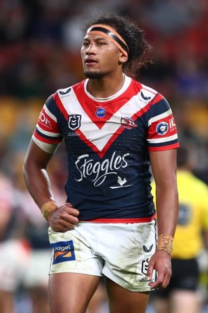 Sitili Tupouniua of the Roosters walks off the field after being sent to the sin-bin during the round 24 NRL match between the Sydney Roosters and...