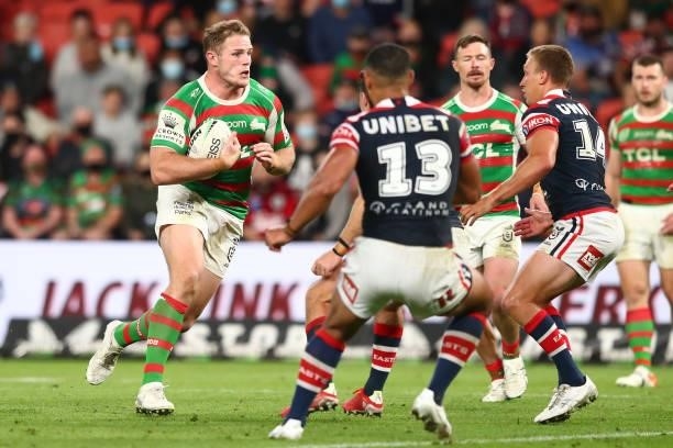 Thomas Burgess of the Rabbitohs is tackled during the round 24 NRL match between the Sydney Roosters and the South Sydney Rabbitohs at Suncorp...