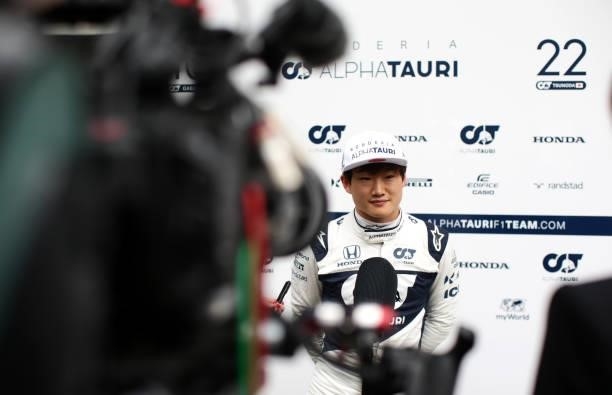 Yuki Tsunoda of Japan and Scuderia AlphaTauri talks to the media in the Paddock after practice ahead of the F1 Grand Prix of Belgium at Circuit de...