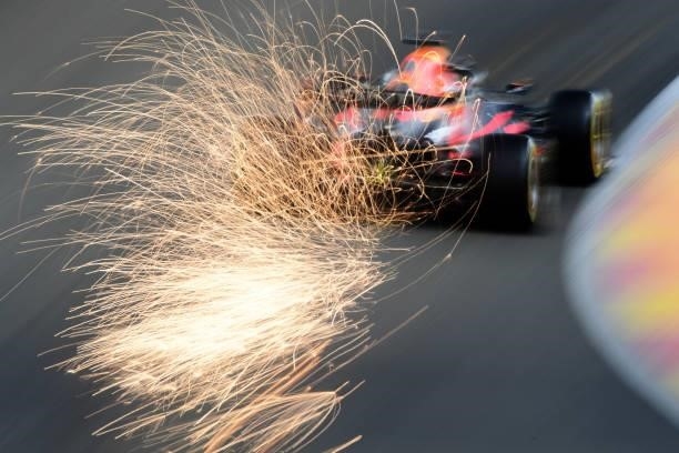 Sparks fly behind Max Verstappen of the Netherlands driving the Red Bull Racing RB16B Honda during practice ahead of the F1 Grand Prix of Belgium at...