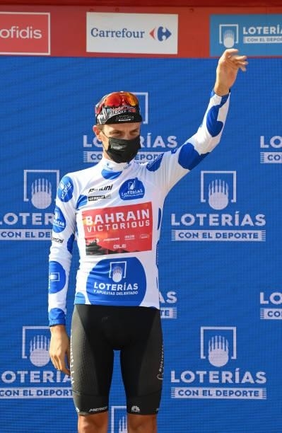 Damiano Caruso of Italy and Team Bahrain Victorious celebrates winning the polka dot mountain jersey on the podium ceremony after the 76th Tour of...