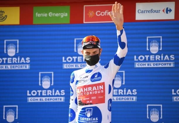 Damiano Caruso of Italy and Team Bahrain Victorious celebrates winning the polka dot mountain jersey on the podium ceremony after the 76th Tour of...