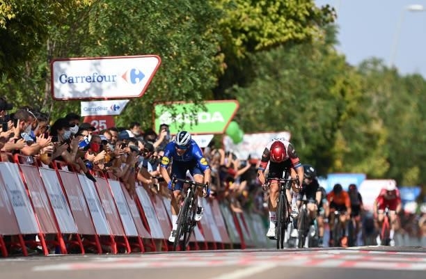 Florian Senechal of France and Team Deceuninck - Quick-Step sprint to win ahead of Matteo Trentin of Italy and UAE Team Emirates during the 76th Tour...