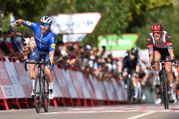 Florian Senechal of France and Team Deceuninck - Quick-Step celebrates winning ahead of Matteo Trentin of Italy and UAE Team Emirates during the 76th...