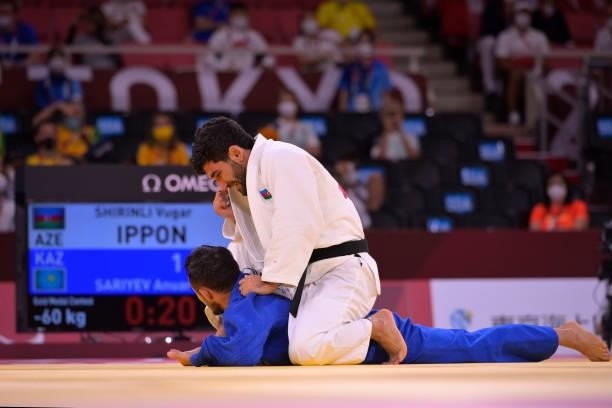 Vugar Shirinli of team Azerbaijan and Anuar Sariyev of team Kazakhstan compete in the Men's -60kg Judo Bronze Medal Contest on day 3 of the Tokyo...