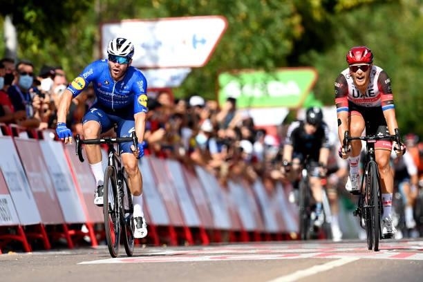 Florian Senechal of France and Team Deceuninck - Quick-Step sprint to win ahead of Matteo Trentin of Italy and UAE Team Emirates during the 76th Tour...