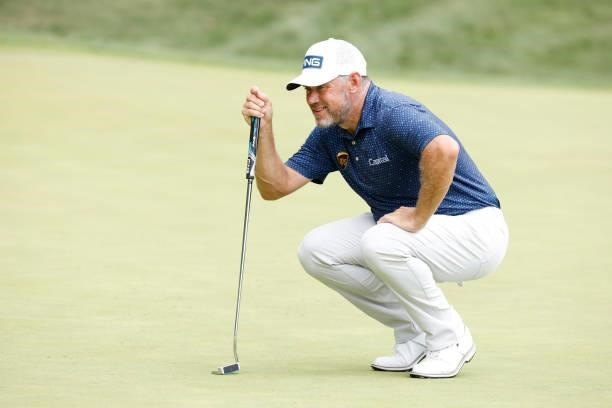 Lee Westwood of England lines up a putt on the eighth green during the second round of the BMW Championship at Caves Valley Golf Club on August 27,...