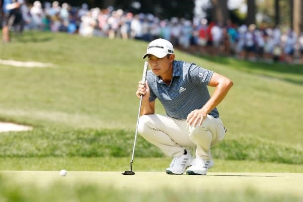 Collin Morikawa of the United States lines up a putt on the first green during the second round of the BMW Championship at Caves Valley Golf Club on...