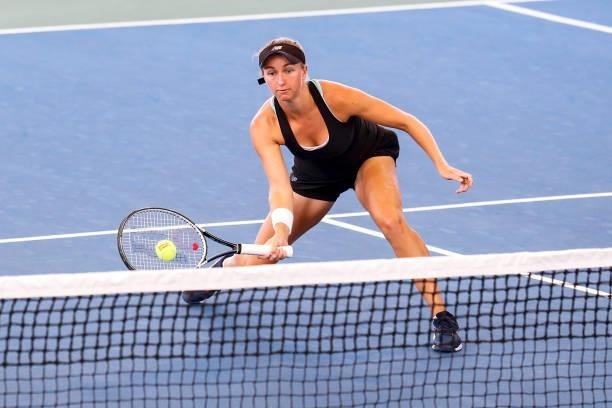 Catherine Harrison of the United States volleys the ball during the first set of her semifinals doubles match against Christina McHale of the United...