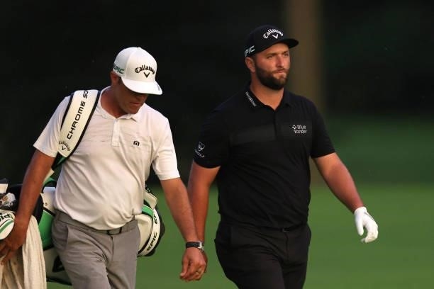 Jon Rahm of Spain walks with his caddie Adam Hayes on the 16th hole during the second round of the BMW Championship at Caves Valley Golf Club on...
