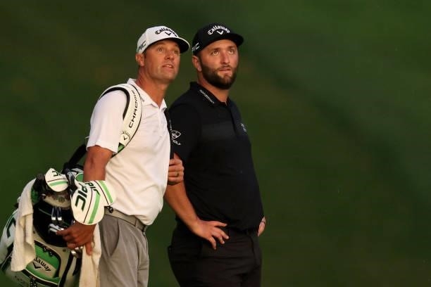 Jon Rahm of Spain talks with his caddie Adam Hayes on the 16th hole during the second round of the BMW Championship at Caves Valley Golf Club on...