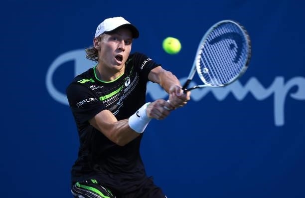 Emil Ruusuvuori of Finland returns a shot to Ilya Ivashka of Belarus during the semifinals of the Winston-Salem Open at Wake Forest Tennis Complex on...