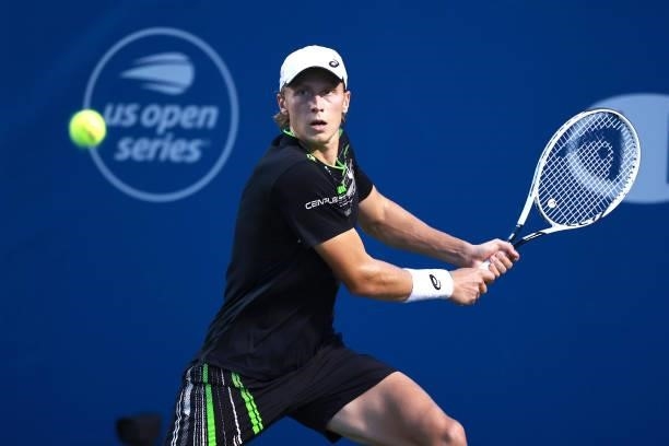 Emil Ruusuvuori of Finland returns a shot to Ilya Ivashka of Belarus during the semifinals of the Winston-Salem Open at Wake Forest Tennis Complex on...
