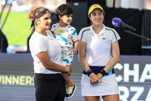 Sania Mirza of India, her son and Christina McHale of the United States are interviewed after winning in the second set of their semifinal doubles...