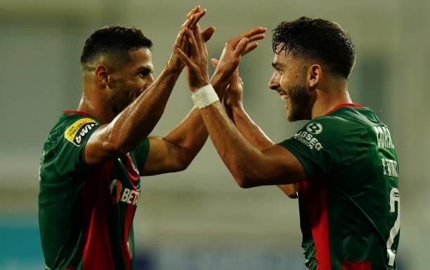 Claudio Winck of CS Maritimo celebrates with teammate Ali Alipour of CS Maritimo after scoring a goal during the Liga Bwin match between GD Estoril...