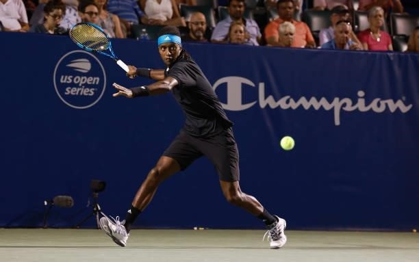 Mikael Ymer of Sweden returns a shot to Carlos Alcaraz of Spain during the semifinals of the Winston-Salem Open at Wake Forest Tennis Complex on...
