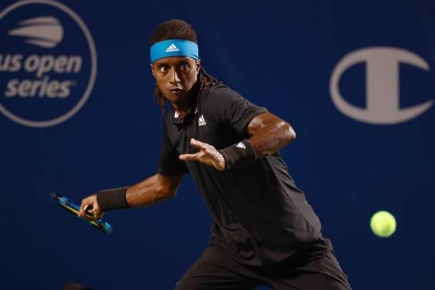 Mikael Ymer of Sweden returns a shot to Carlos Alcaraz of Spain during the semifinals of the Winston-Salem Open at Wake Forest Tennis Complex on...