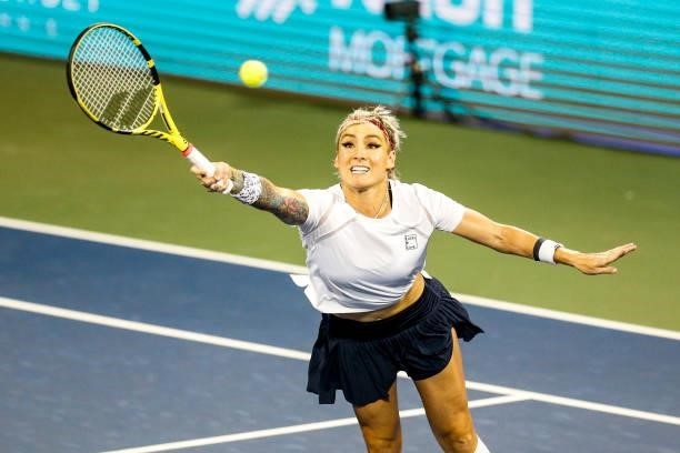Bethanie Mattek-Sands of the United States volleys the ball during the first set of her semifinal doubles match against Ena Shibahara of Japan and...
