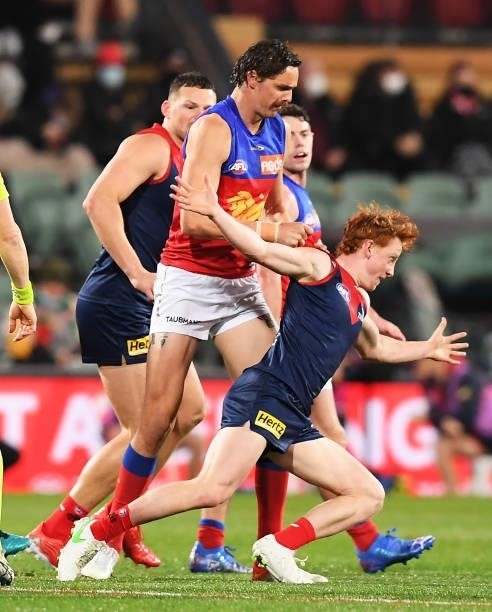 Joe Daniher of the Lions shoves Jake Bowey of the Demons during the AFL First Qualifying Final match between Melbourne Demons and Brisbane Lions at...