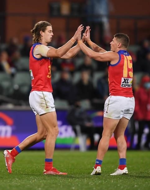 Jarrod Berry of the Lions celebrates a goal with Dayne Zorko of the Lions during the AFL First Qualifying Final match between Melbourne Demons and...