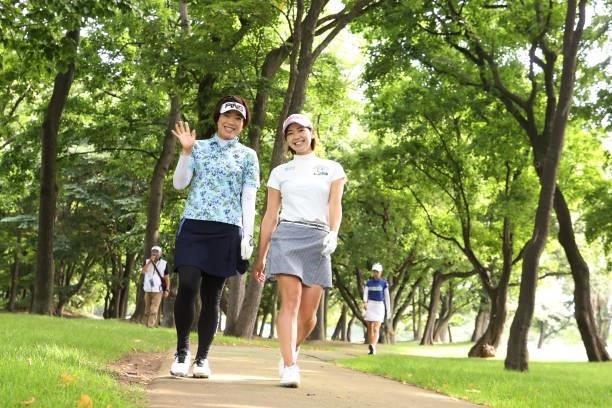 Shiho Oyama of Japan and Rumi Yoshiba of Japan smile during the third round of the Nitori Ladies at Otaru Country Club on August 28, 2021 in Otaru,...