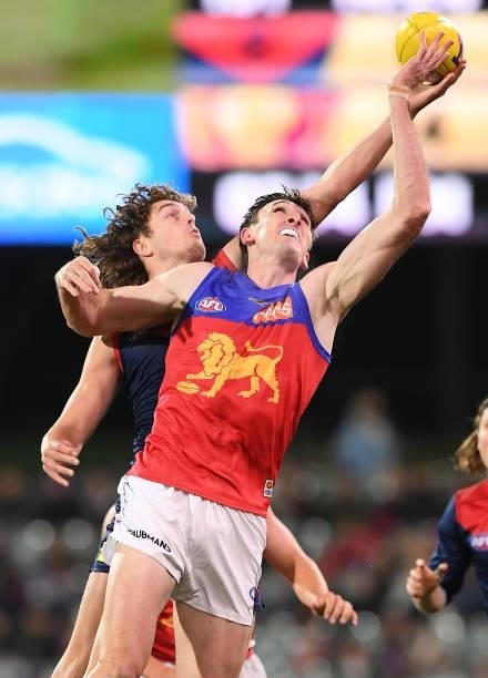 Oscar McInerney of the Lions rucks against Luke Jackson of the Demons during the AFL First Qualifying Final match between Melbourne Demons and...