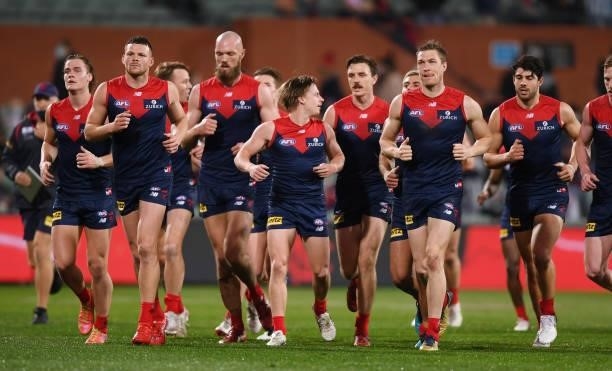 Melbourne head off at half time during the AFL First Qualifying Final match between Melbourne Demons and Brisbane Lions at Adelaide Oval on August...