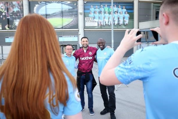 Former Manchester City player, Shaun Goater, poses for a photograph with fans prior to the Premier League match between Manchester City and Arsenal...