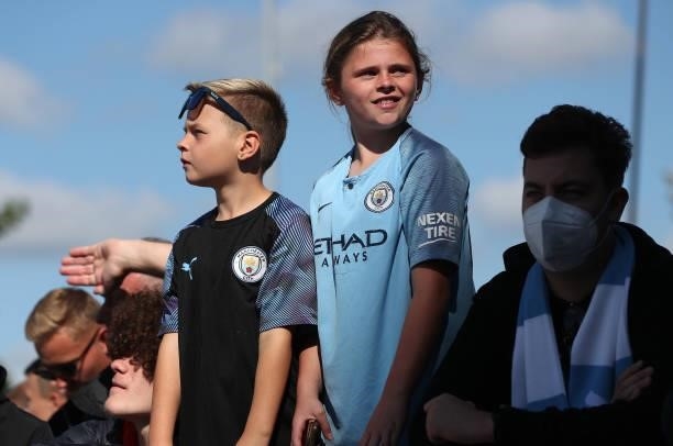 Manchester City Fans show their support prior to the Premier League match between Manchester City and Arsenal at Etihad Stadium on August 28, 2021 in...