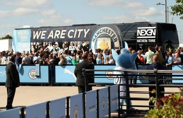 Fans show their support as the Manchester City player coach arrives prior to the Premier League match between Manchester City and Arsenal at Etihad...