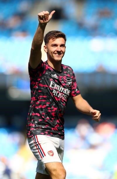 Kieran Tierney of Arsenal warms up ahead of the Premier League match between Manchester City and Arsenal at Etihad Stadium on August 28, 2021 in...