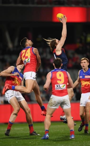 Ben Brown of the Demons marks in front of Marcus Adams of the Lions during the AFL First Qualifying Final match between Melbourne Demons and Brisbane...
