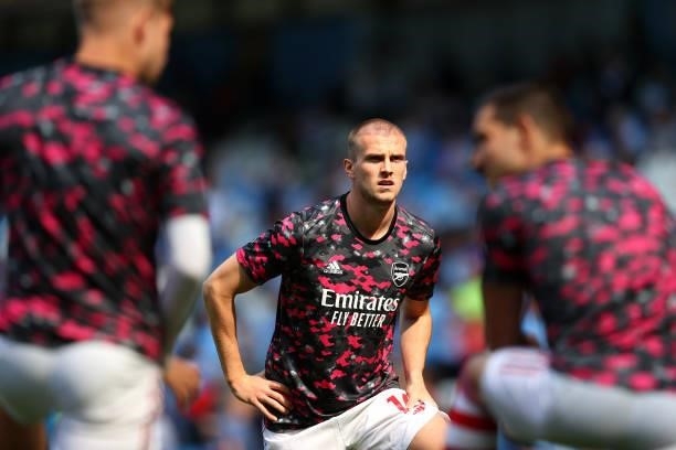 Rob Holding of Arsenal looks on during the warm up prior to the Premier League match between Manchester City and Arsenal at Etihad Stadium on August...