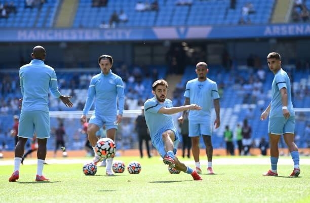 Bernardo Silva of Manchester City warms up prior to the Premier League match between Manchester City and Arsenal at Etihad Stadium on August 28, 2021...